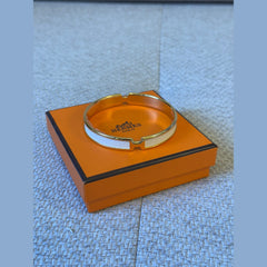 Hermès Olympe Bracelet – White Enamel with Gold Hardware (Size T3)